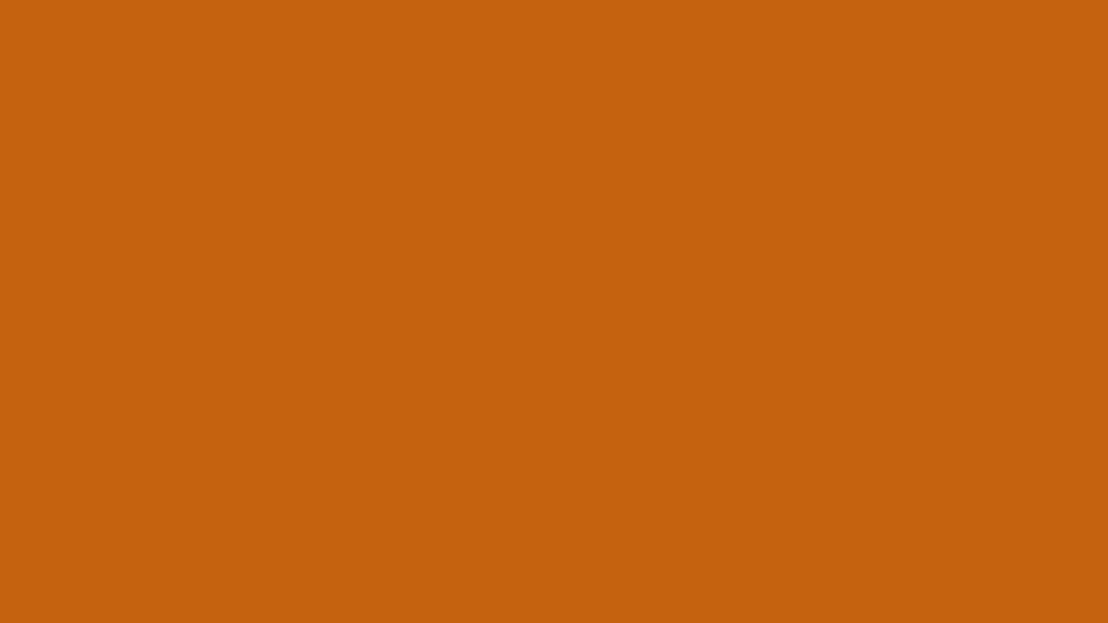 Alloy Orange solid color background preview (#C46210)