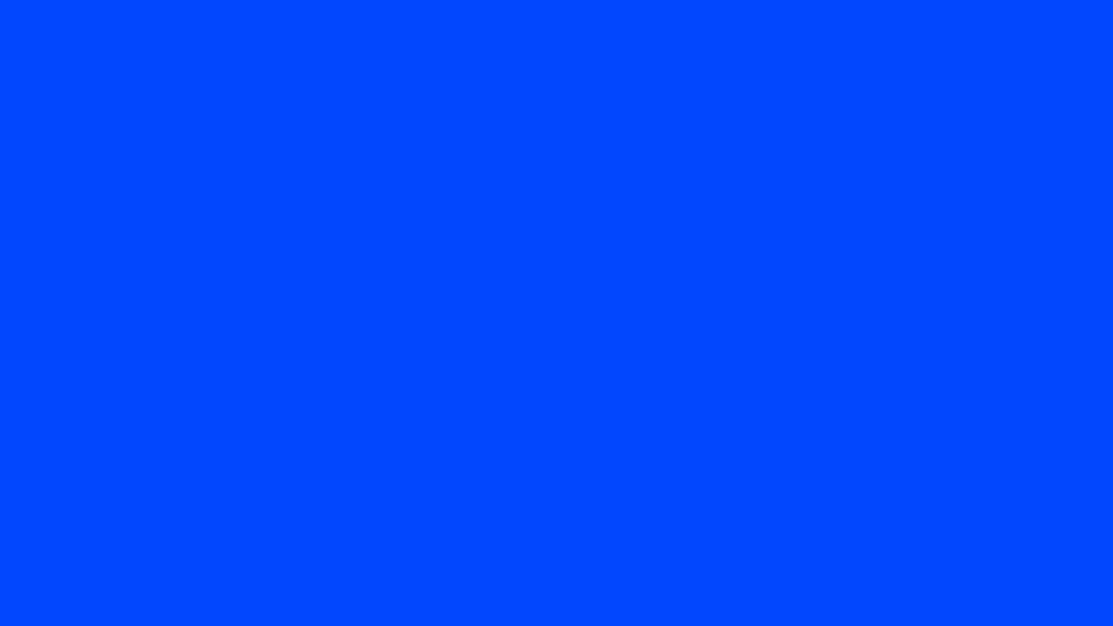 Blue (Ryb) solid color background preview (#0247FE)