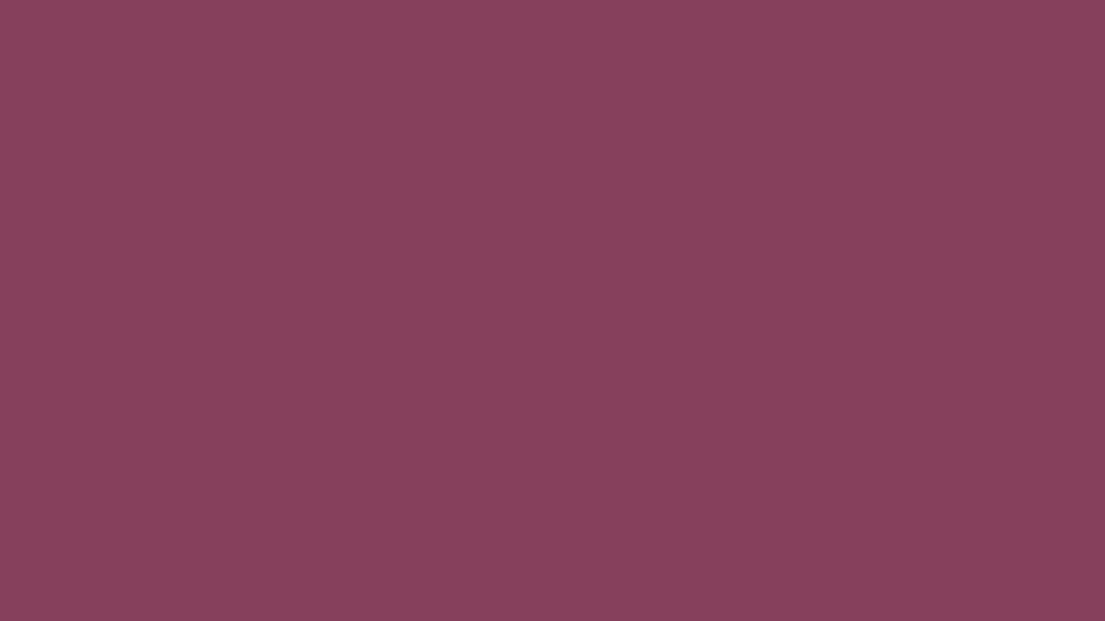 Deep Ruby solid color background preview (#843F5B)