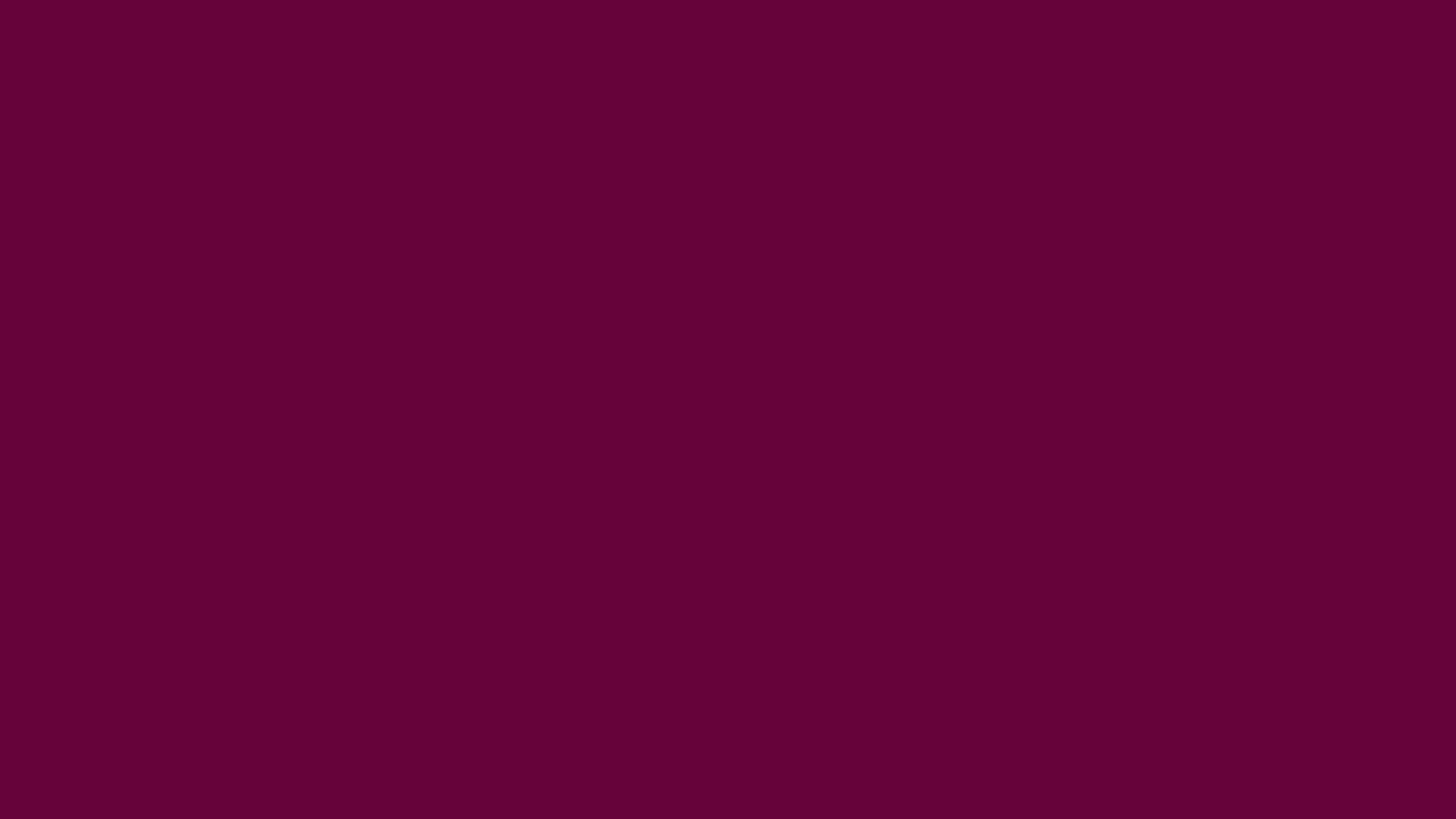 Imperial Purple solid color background preview (#66023C)