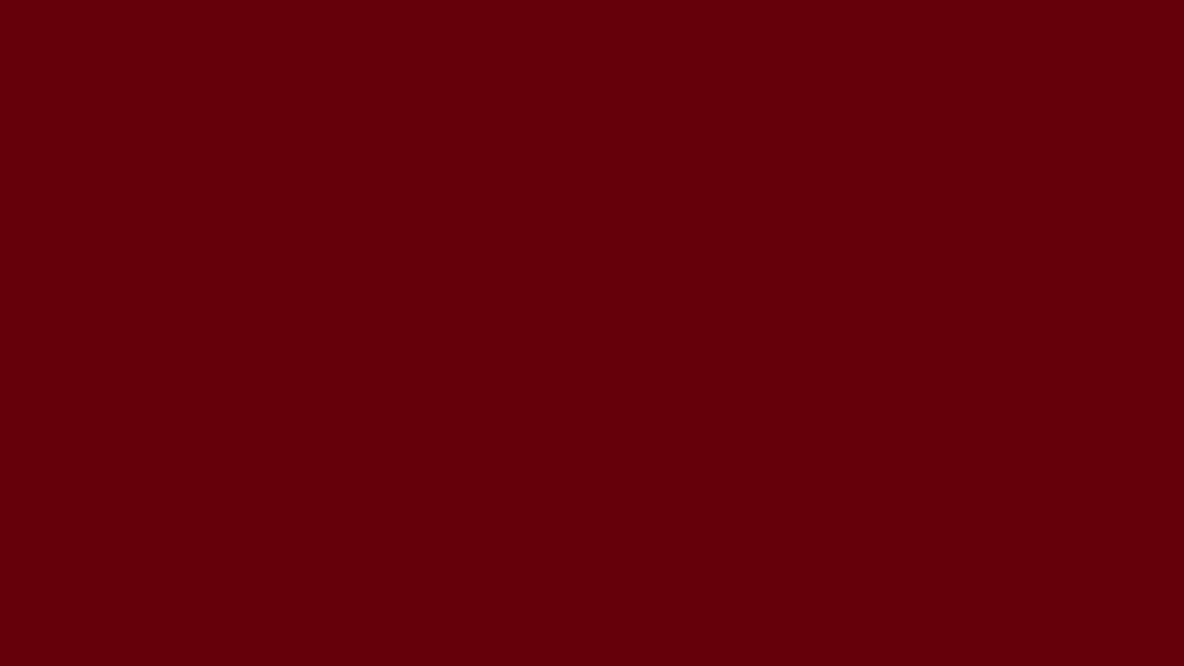 Rosewood solid color background preview (#65000B)